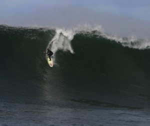 Sarah Gerhardt Surfing a Big Wave